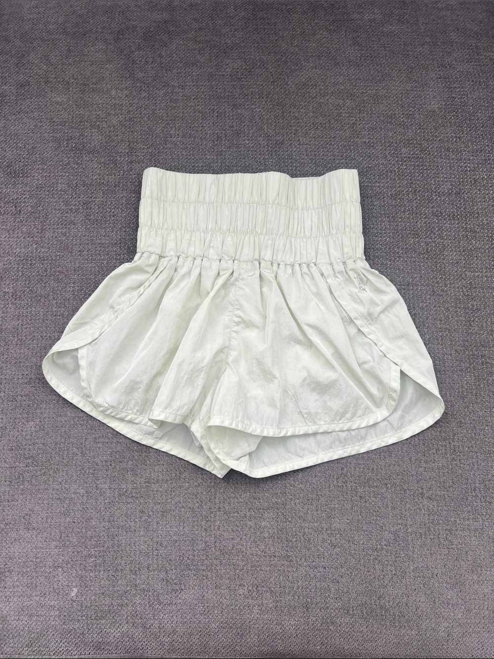 FP Movement by Free People Ivory High-Waist Smocked Ruffle Shorts green light